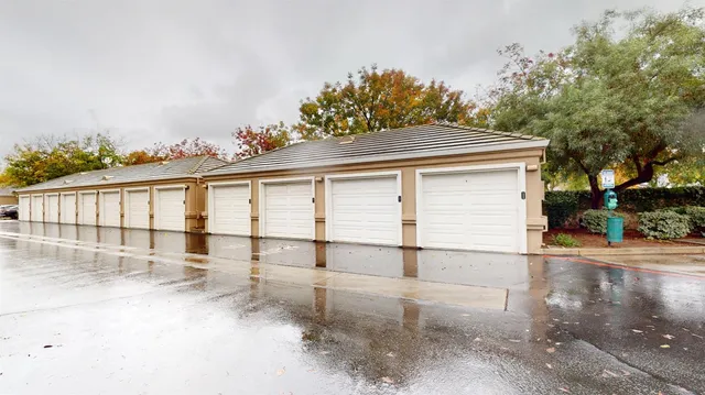 a view of a park with swings and slides