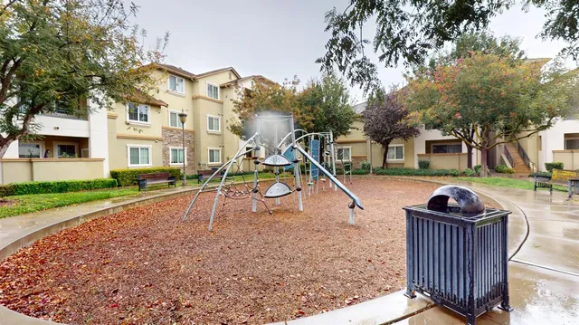 a room with gym equipment and a large window
