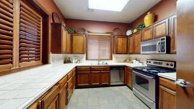 a living room with fireplace furniture and a wooden floor