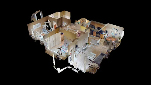 aerial view of a house with pool and chairs