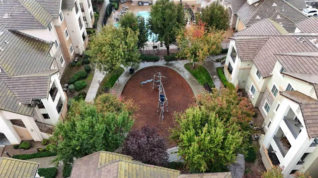 an aerial view of residential houses with outdoor space