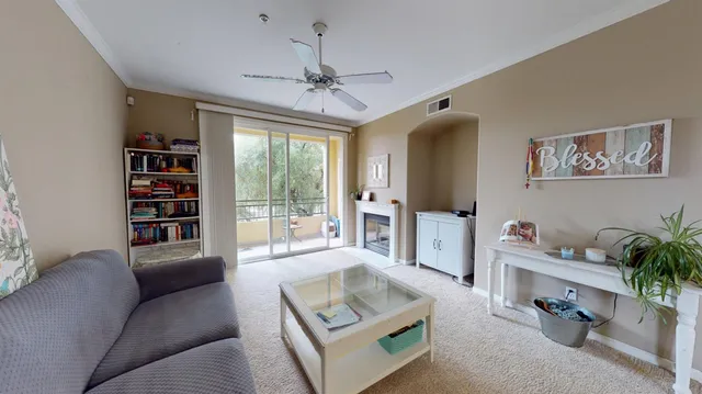 a living room with furniture and a window