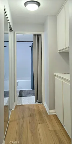 a bathroom with a mirror and a shower