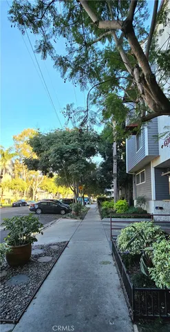 a view of street with parked cars