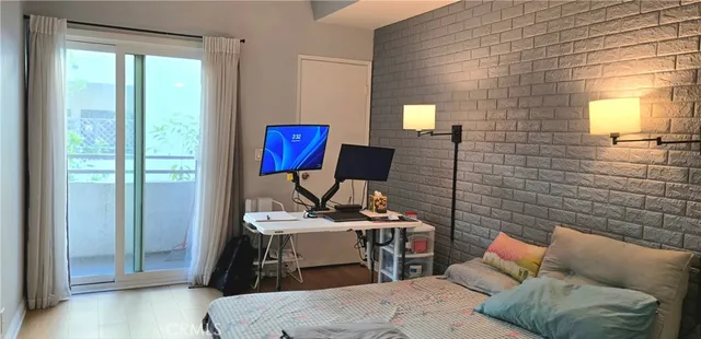 a living room with furniture a rug and a window