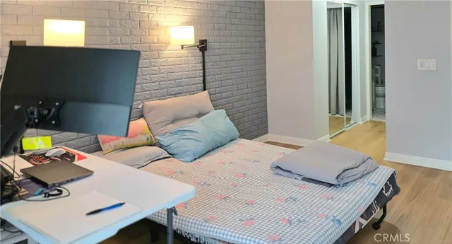 a bedroom with a bed and a desk