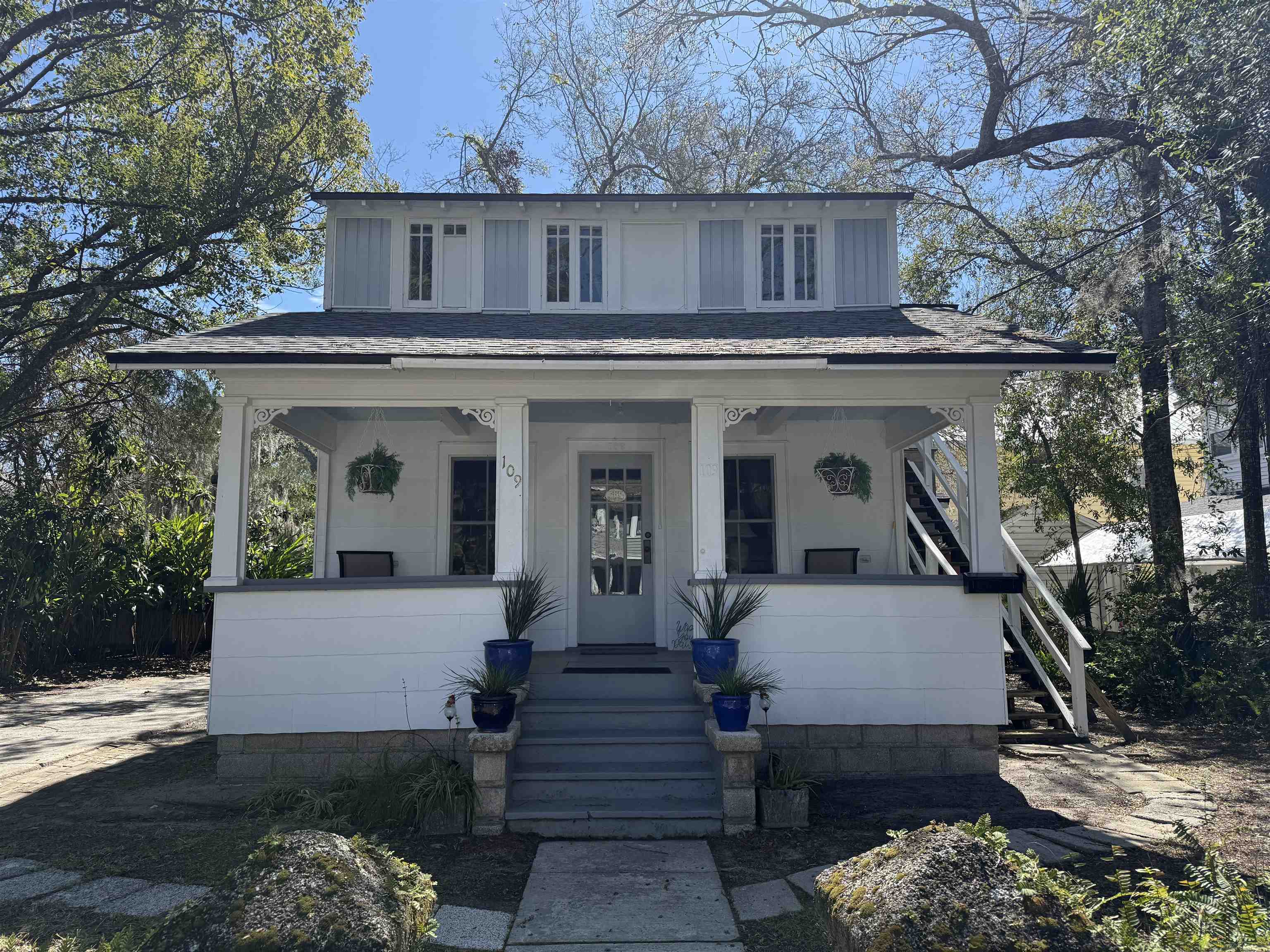 109 Bridge Street St. Augustine, FL 32084 - Photo 1 of 22 a view of a house with a yard and furniture