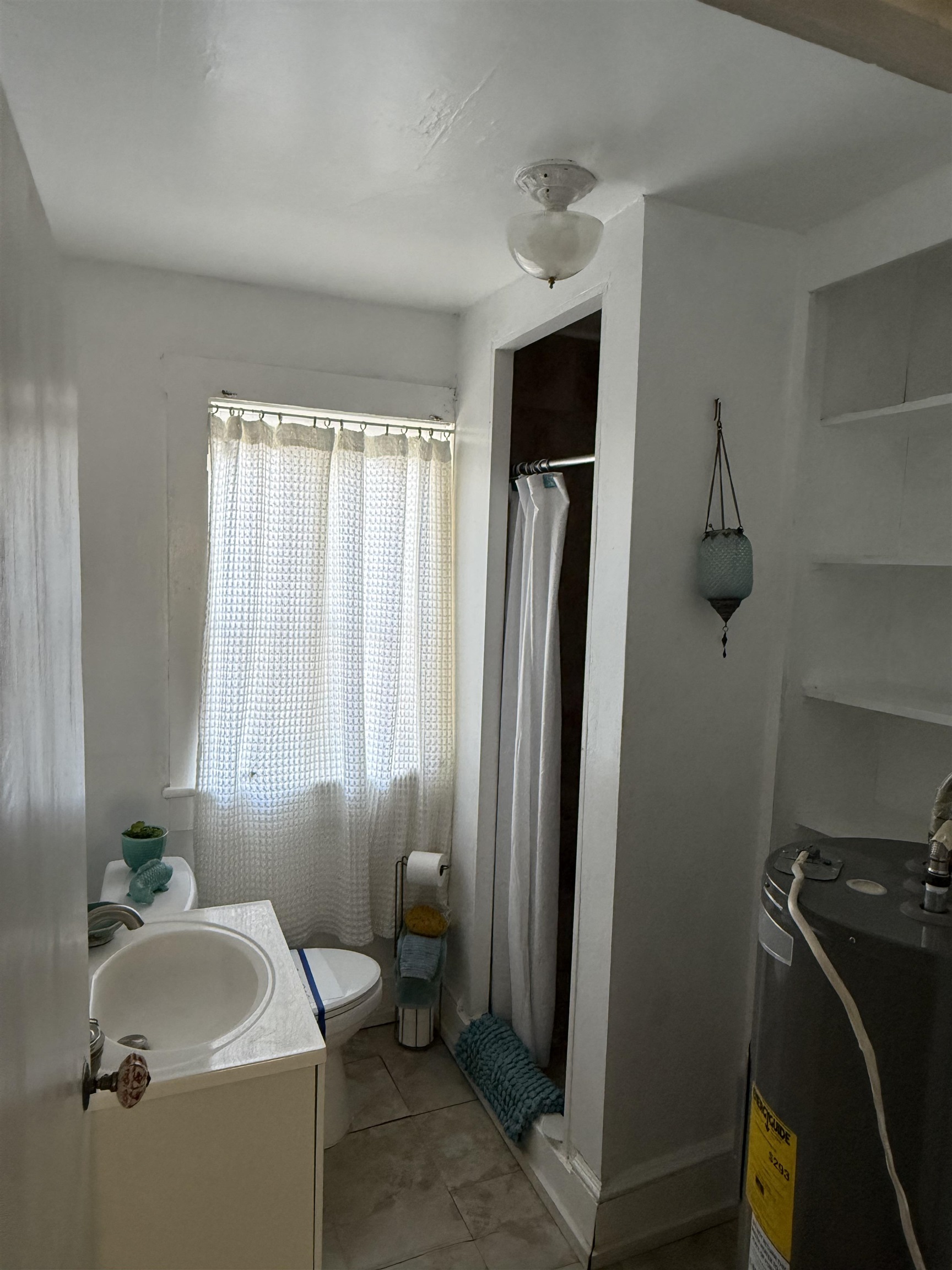 109 Bridge Street St. Augustine, FL 32084 - Photo 11 of 22 a bathroom with a sink toilet and shower