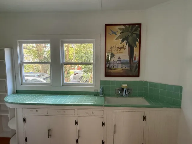 a bathroom with a sink and a window