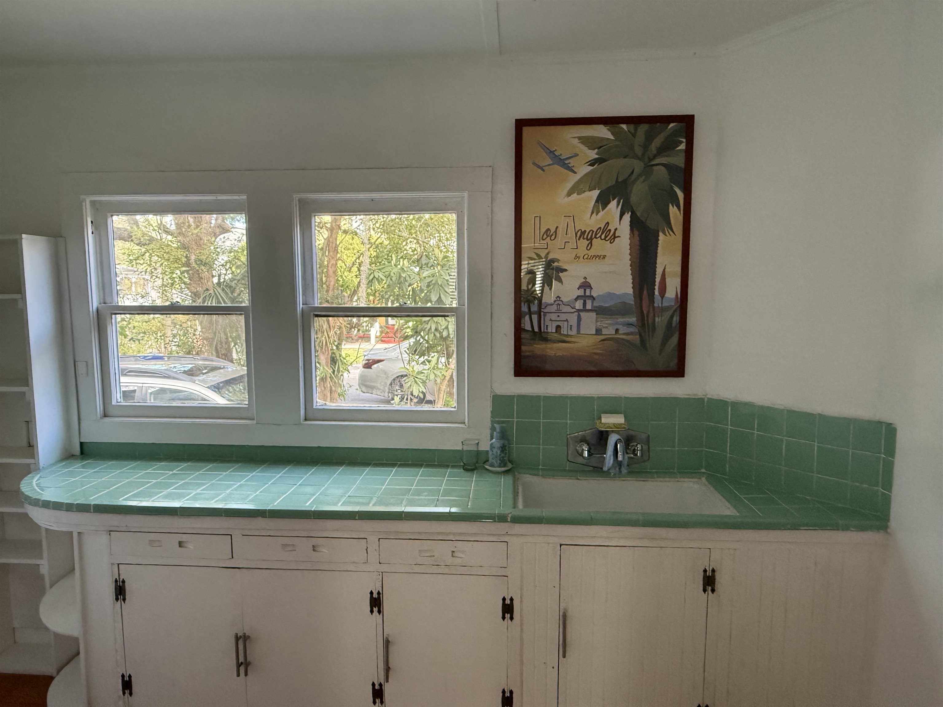 109 Bridge Street St. Augustine, FL 32084 - Photo 12 of 22 a bathroom with a sink and a window