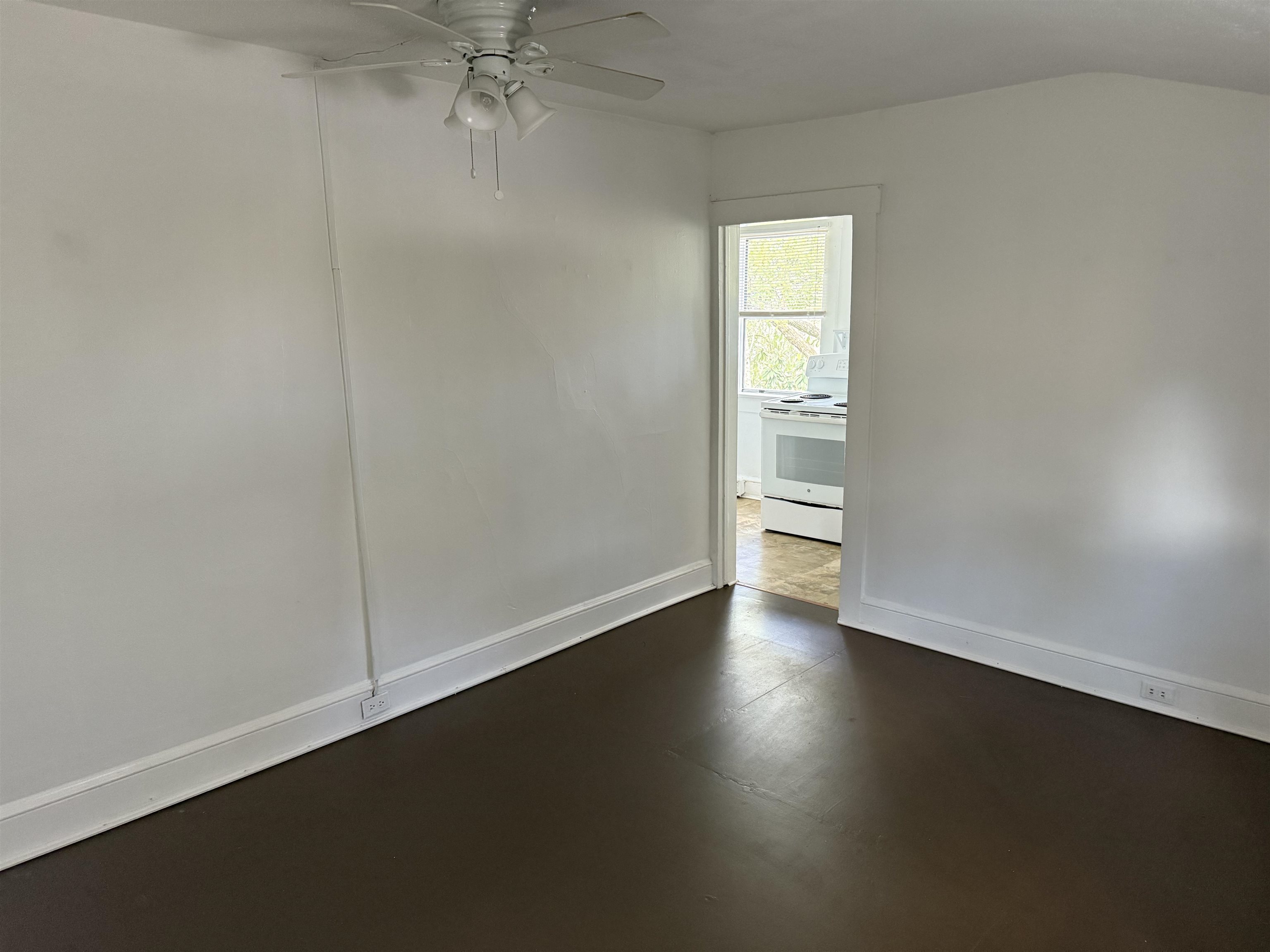 109 Bridge Street St. Augustine, FL 32084 - Photo 16 of 22 an empty room with wooden floor and windows
