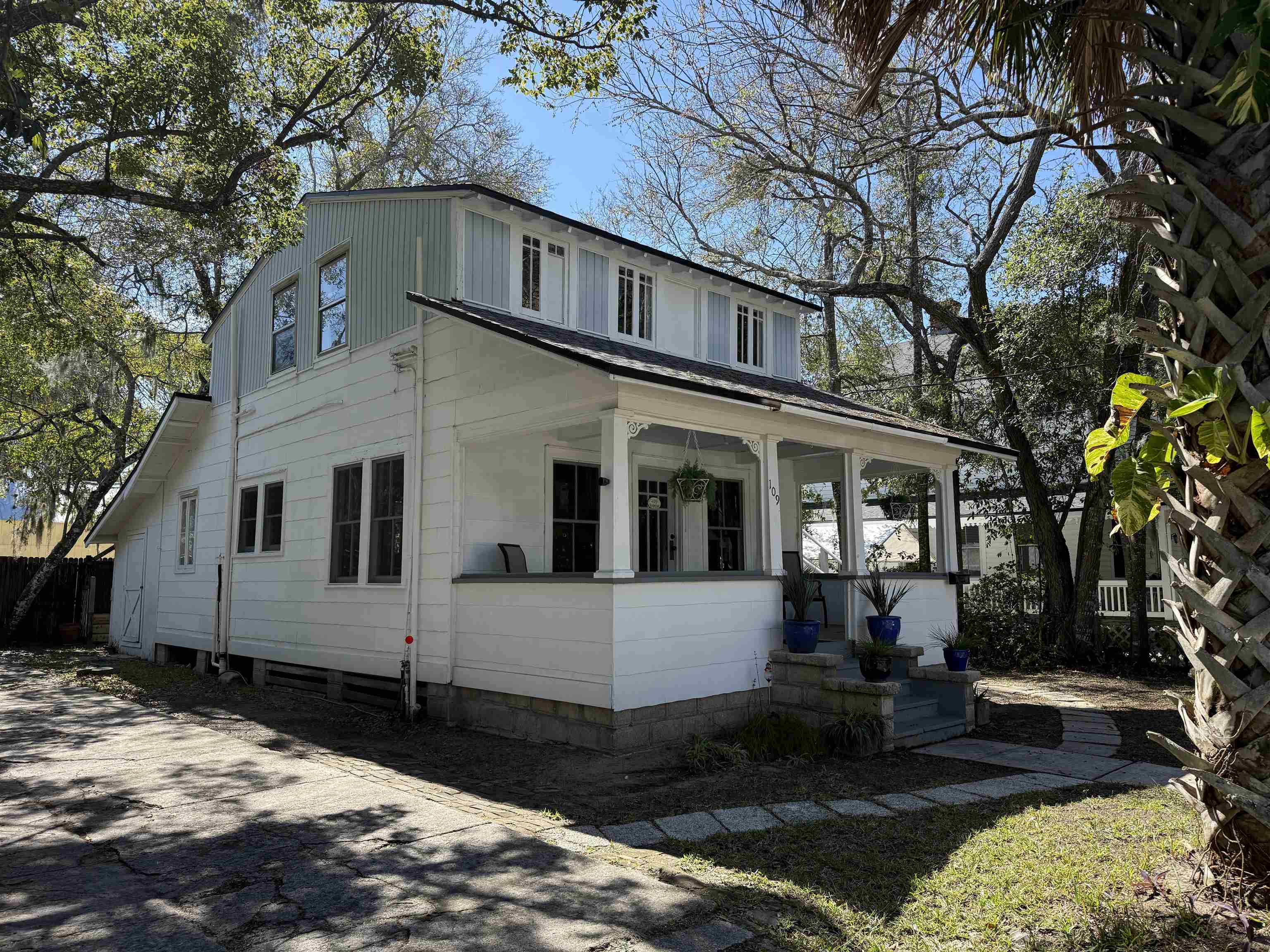 109 Bridge Street St. Augustine, FL 32084 - Photo 2 of 22 a front view of a house with a yard