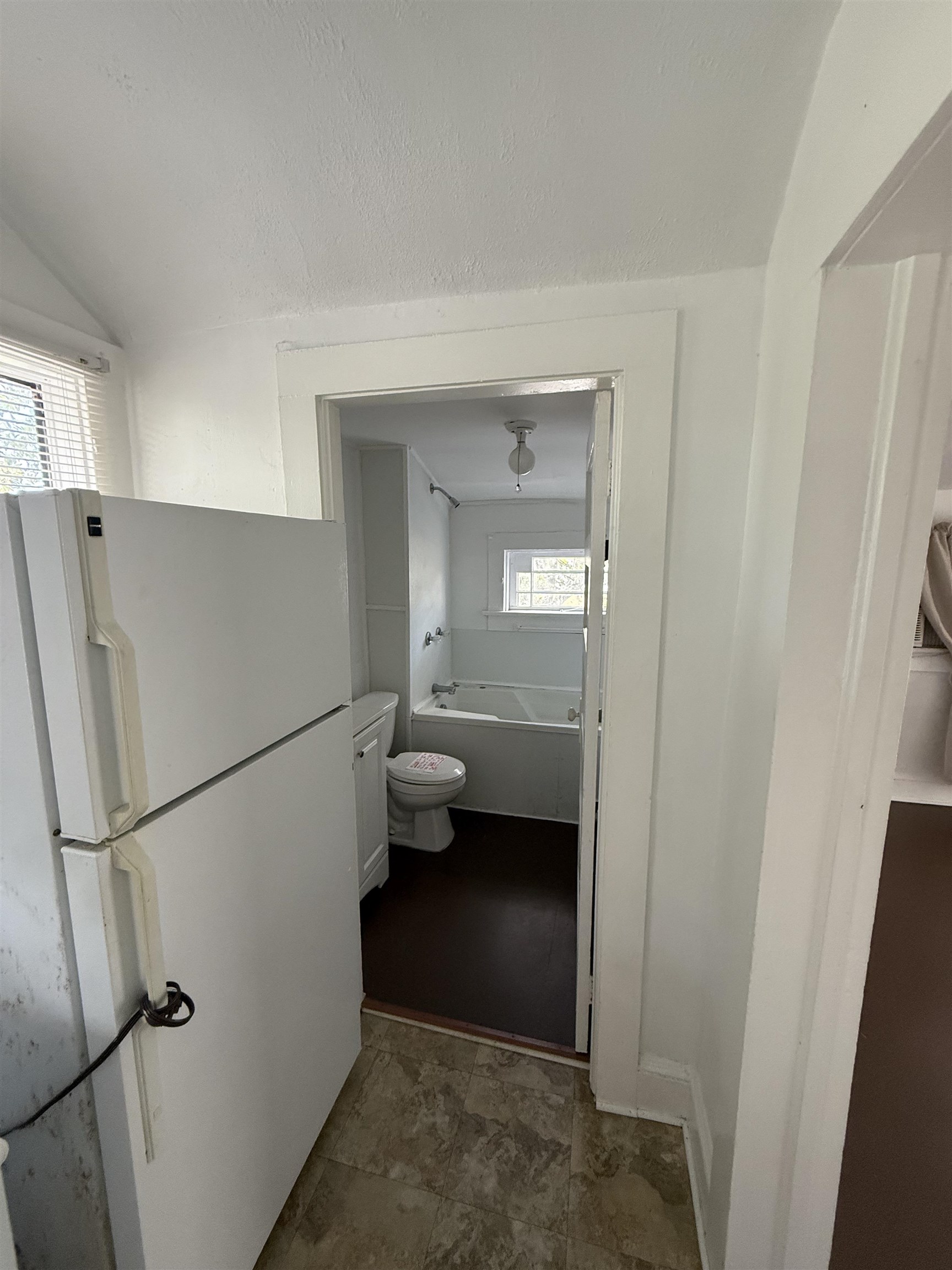 109 Bridge Street St. Augustine, FL 32084 - Photo 22 of 22 a kitchen with a refrigerator and a sink