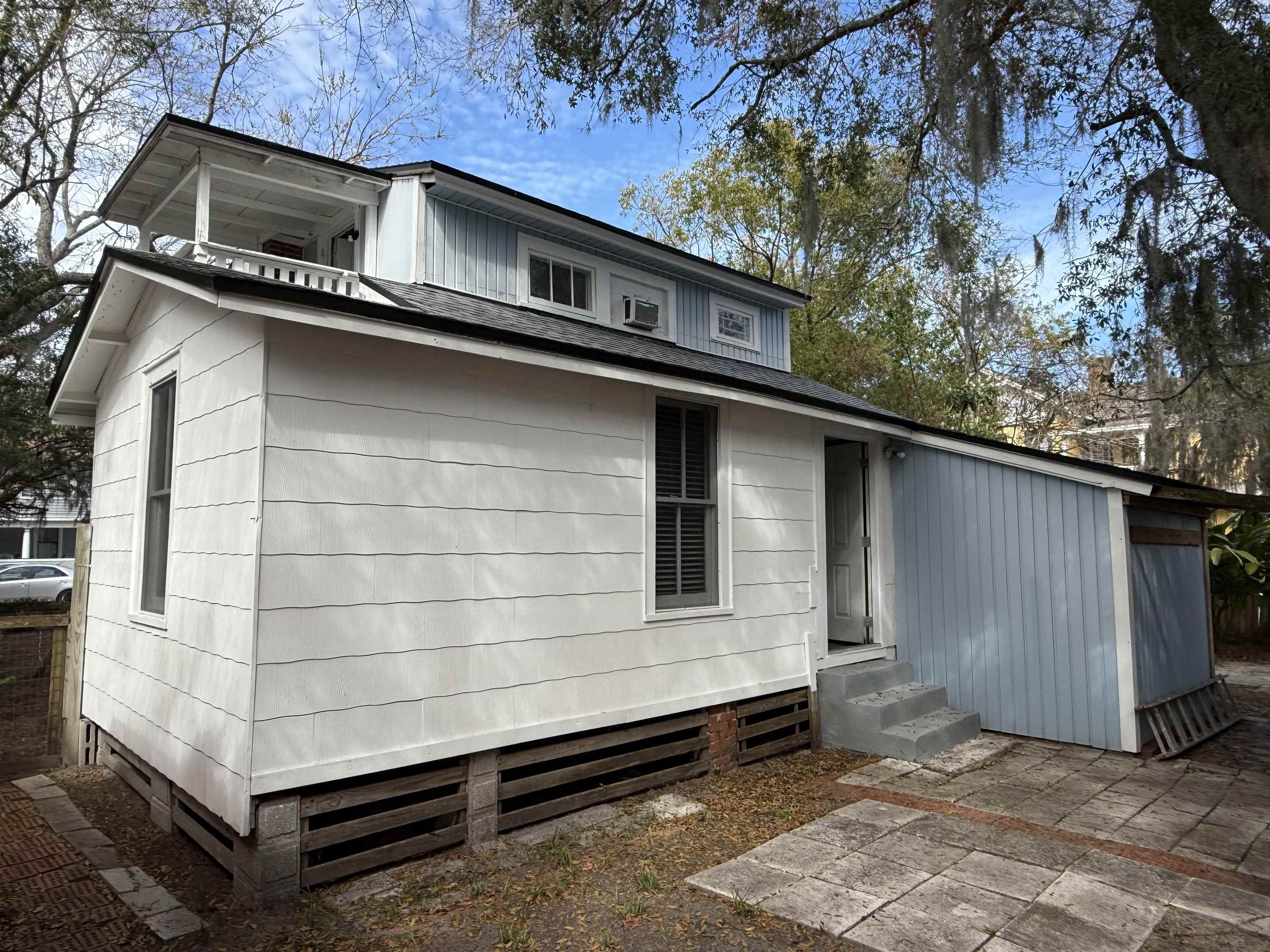 109 Bridge Street St. Augustine, FL 32084 - Photo 4 of 22 a front view of a house with a garage