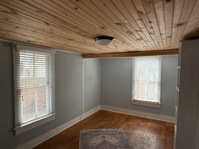 a view of a livingroom with a dishwasher and a window