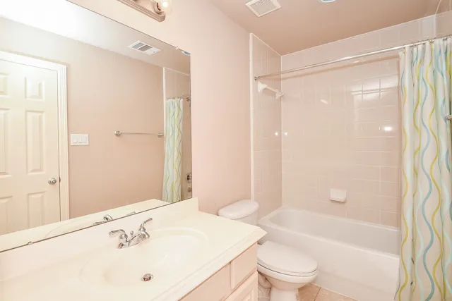 a bathroom with a sink a toilet and a bathtub