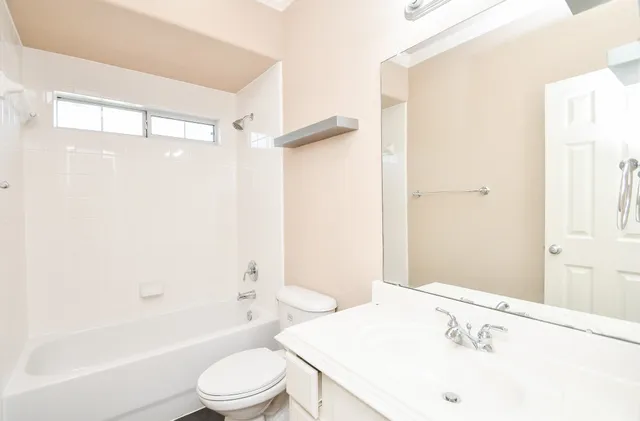 a bathroom with a sink a toilet and a bathtub