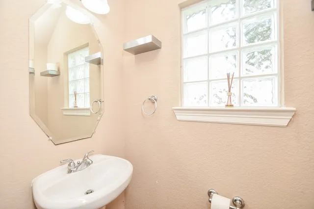 a bathroom with a sink and a mirror