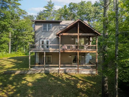 a view of a house with a yard balcony