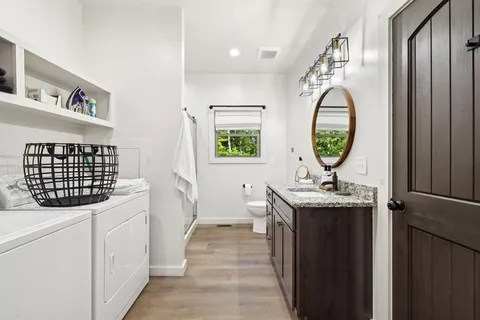 a bathroom with a shower and a sink