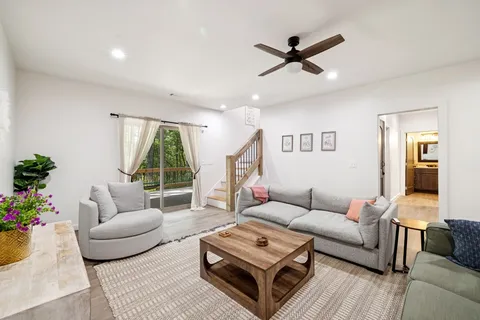 a view of a porch with furniture and a backyard