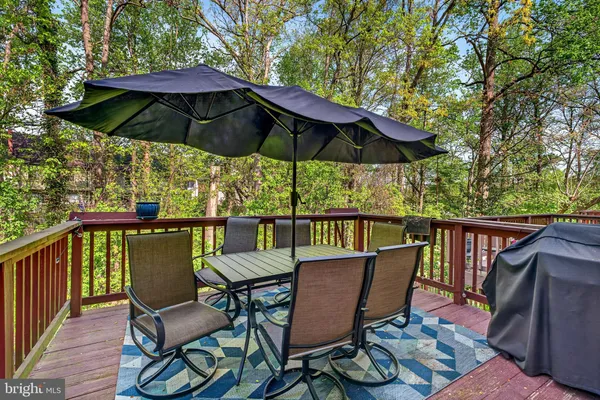 a view of balcony with outdoor seating and wooden floor