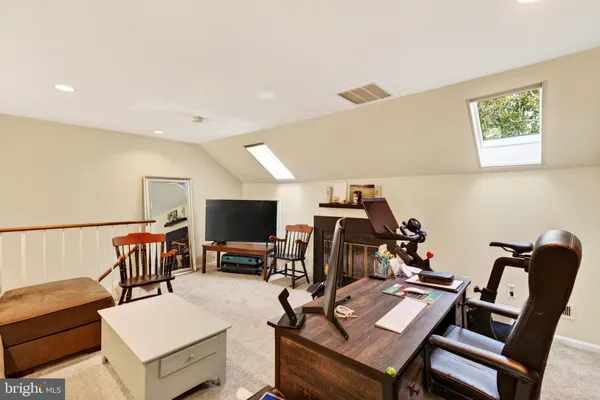 a view of a workspace with furniture and a couch