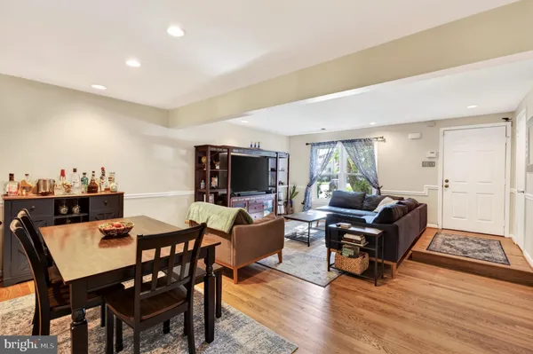 a view of a livingroom with furniture and a flat screen tv