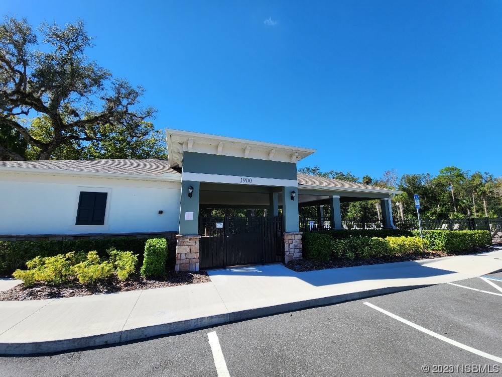 1841 Red Rock Road New Smyrna Beach, FL 32168 - Photo 18 of 22 front view of a house with a yard