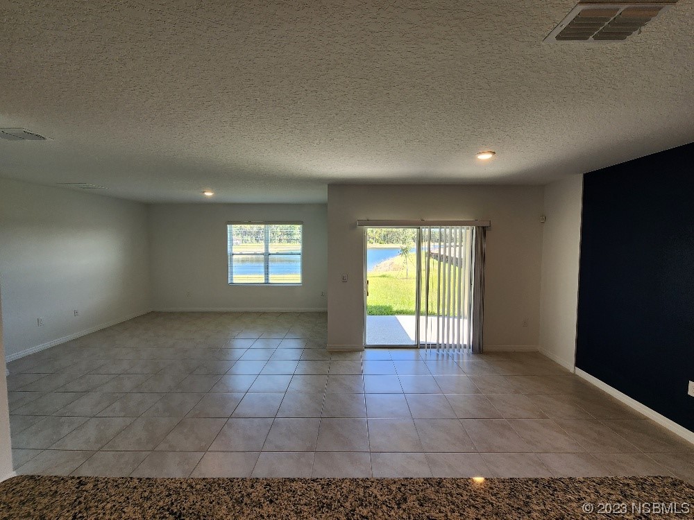 1841 Red Rock Road New Smyrna Beach, FL 32168 - Photo 2 of 22 a view of an empty room with a window
