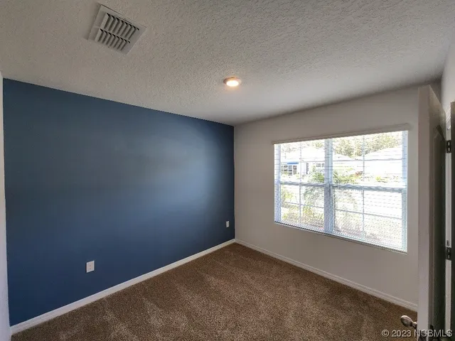 a bathroom with a granite countertop sink mirror and shower