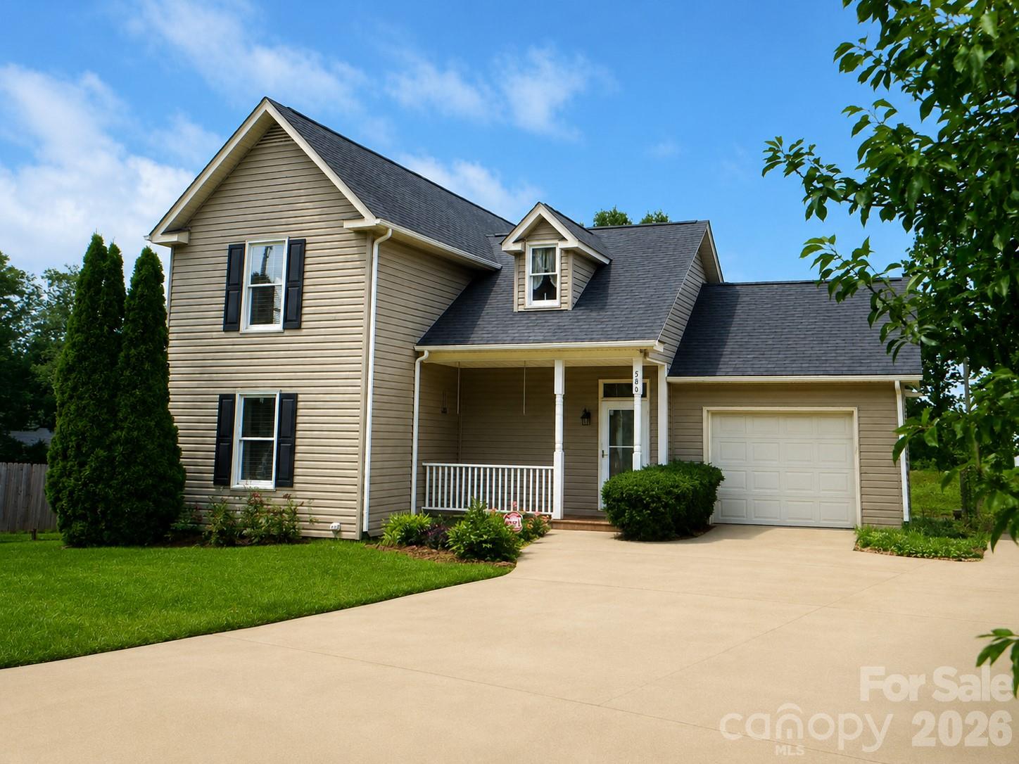 506 Pleasant Street Spindale, NC 28160 - Photo 3 of 42 a front view of a house with a garden