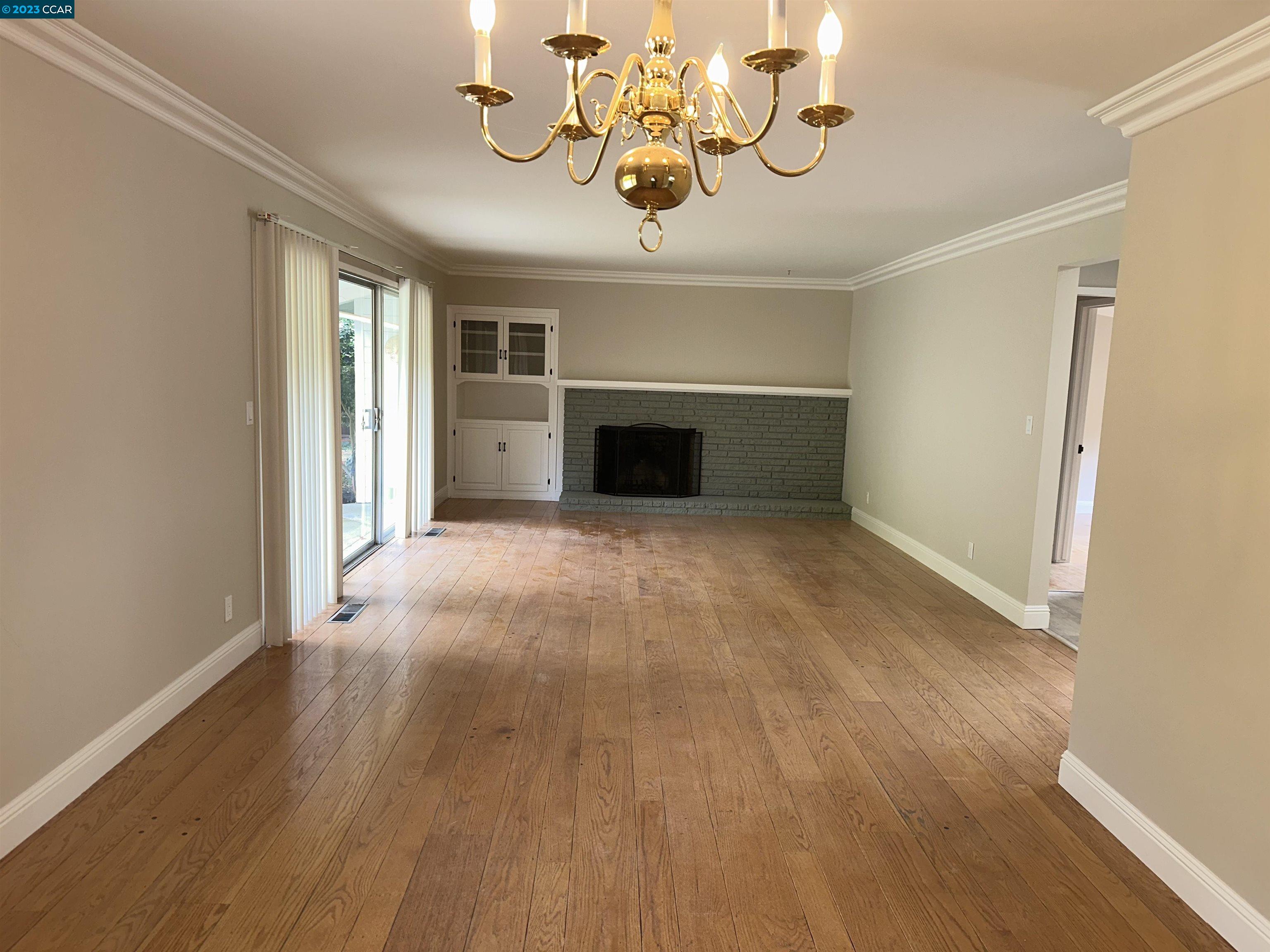 44 Lynwood Place Moraga, CA 94556 - Photo 7 of 12 wooden floor in an empty room with a window