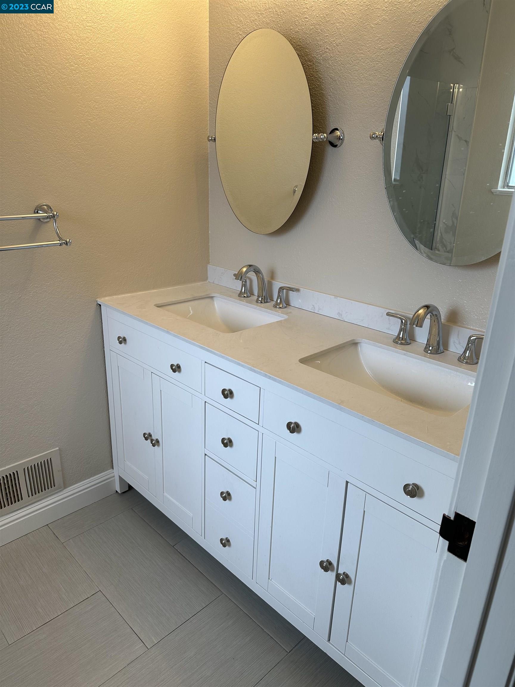 44 Lynwood Place Moraga, CA 94556 - Photo 10 of 12 a bathroom with a double vanity sink and mirror
