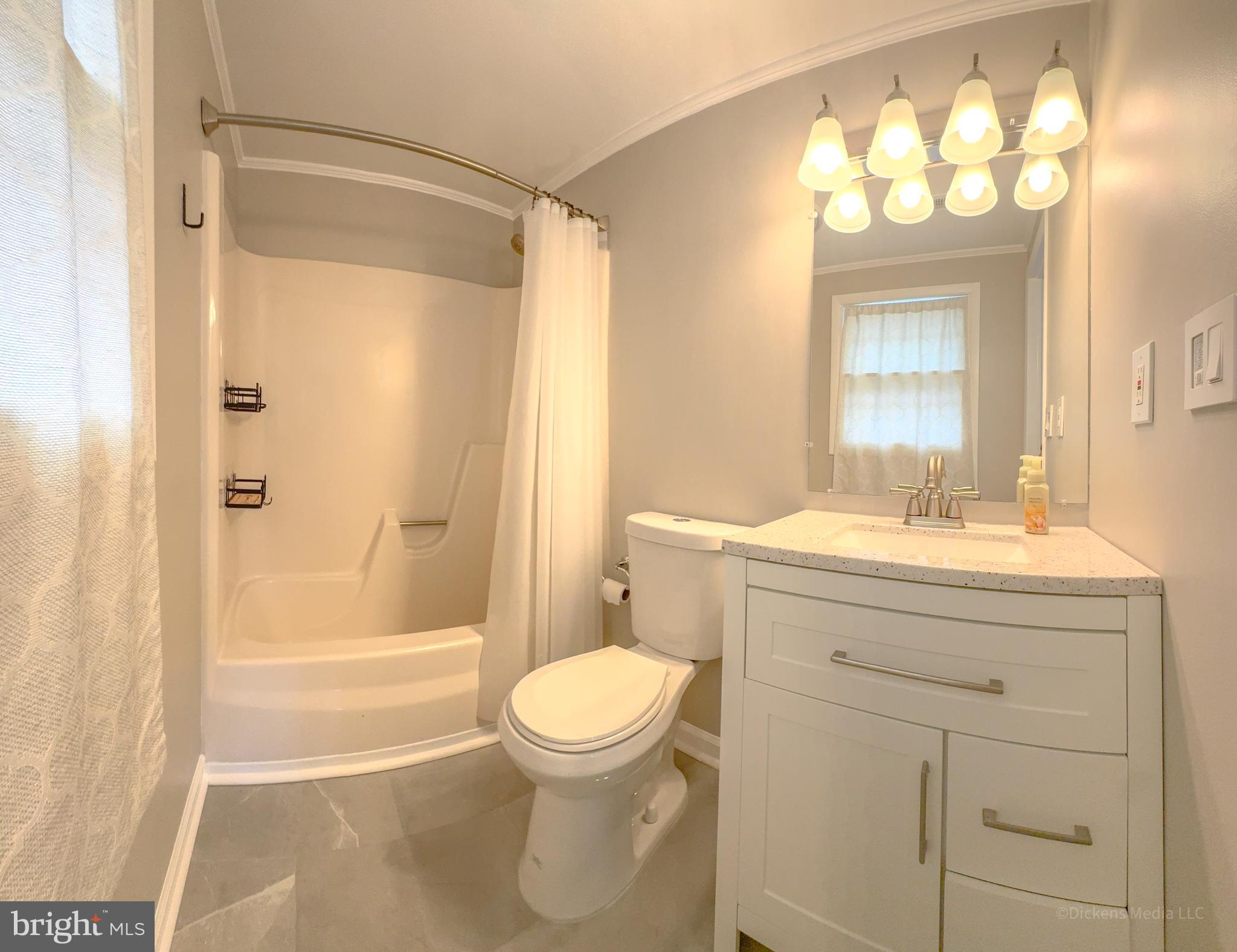 25 John Owings Road Westminster, MD 21158 - Photo 12 of 32 a bathroom with a sink a toilet and shower