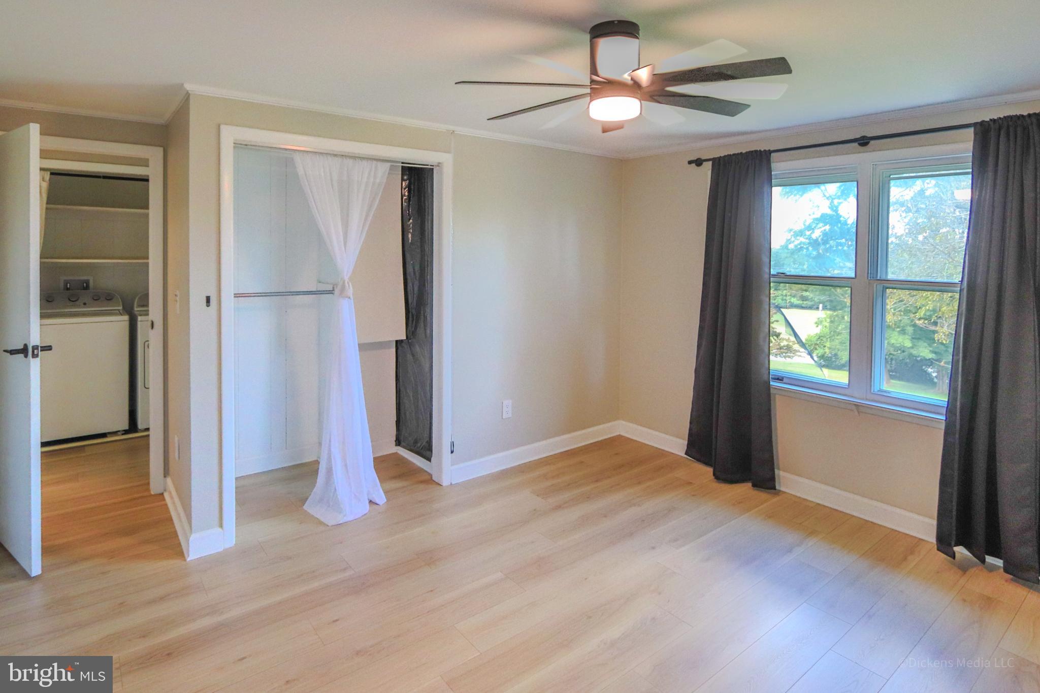25 John Owings Road Westminster, MD 21158 - Photo 16 of 32 a view of empty room with wooden floor and fan