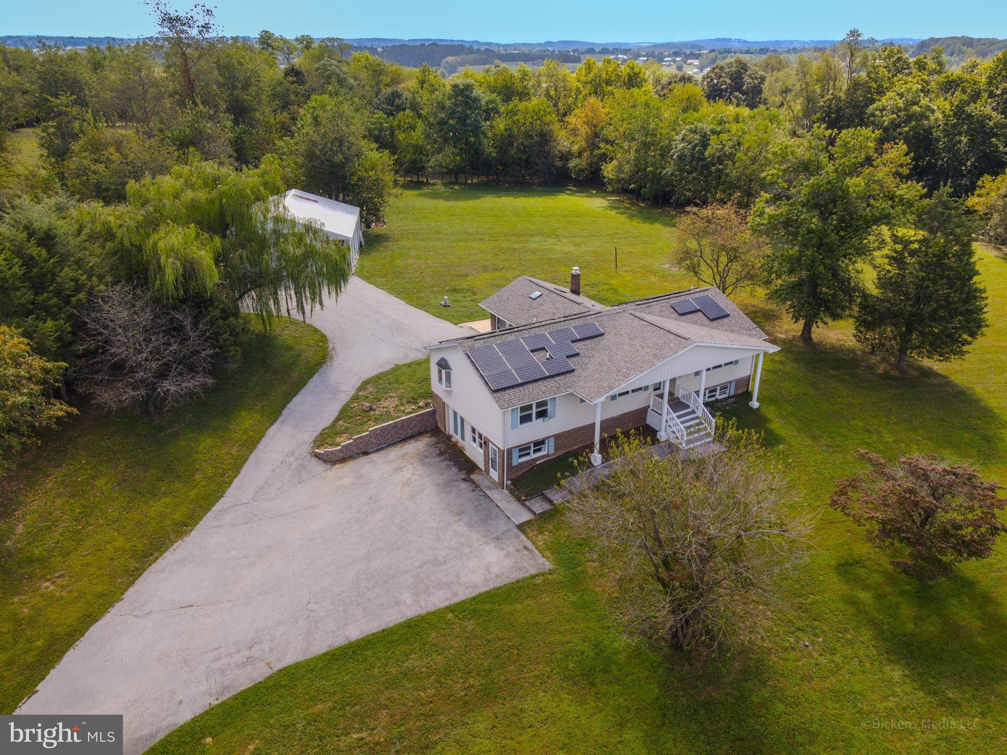 25 John Owings Road Westminster, MD 21158 - Photo 24 of 32 an aerial view of a house with garden space and a lake view
