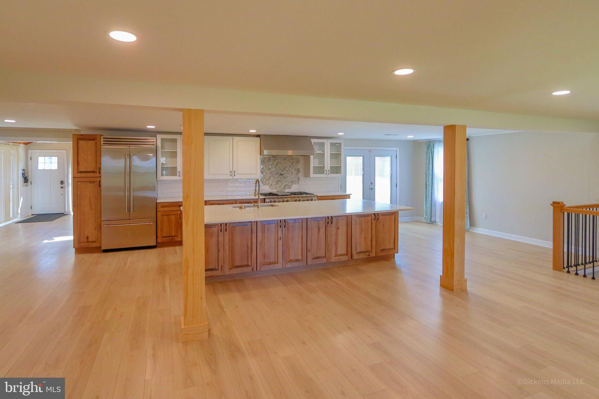 25 John Owings Road Westminster, MD 21158 - Photo 4 of 32 a view of a kitchen with a sink and a refrigerator