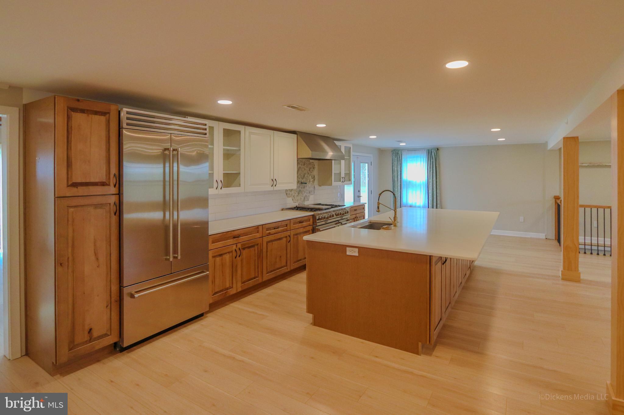 25 John Owings Road Westminster, MD 21158 - Photo 6 of 32 a kitchen with stainless steel appliances granite countertop a refrigerator a sink and a stove