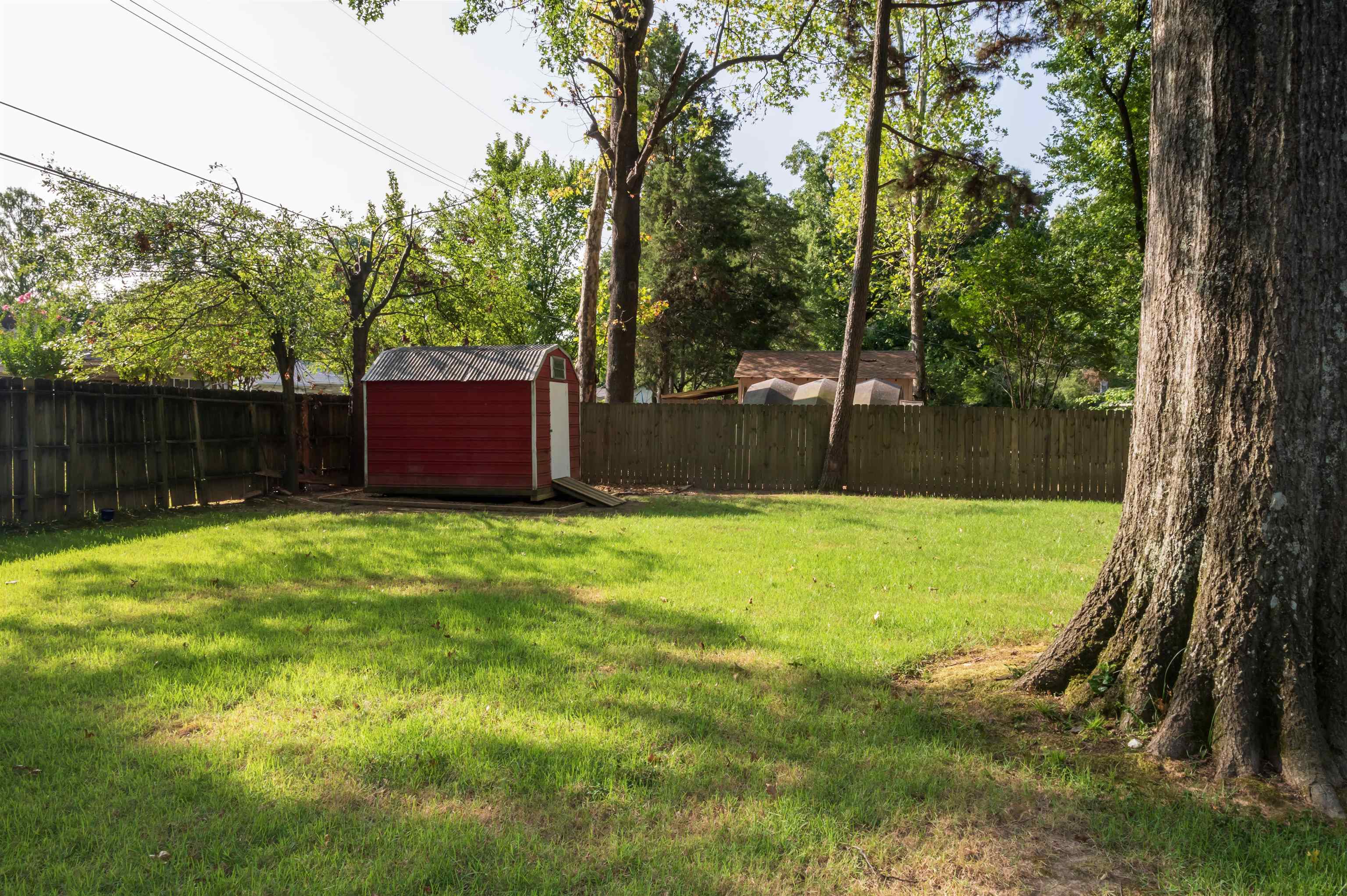 1194 Perkins Terrace Memphis, TN 38117 - Photo 26 of 29 View of yard featuring a storage shed