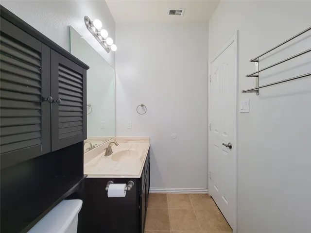 a bathroom with a sink a mirror and shower view