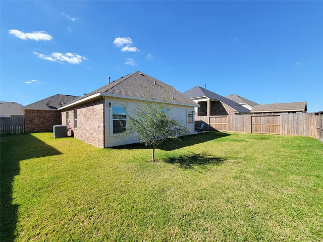 a front view of a house with yard and garage