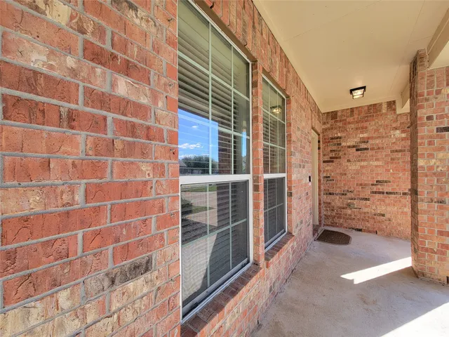 a view of walk in closet and bedroom