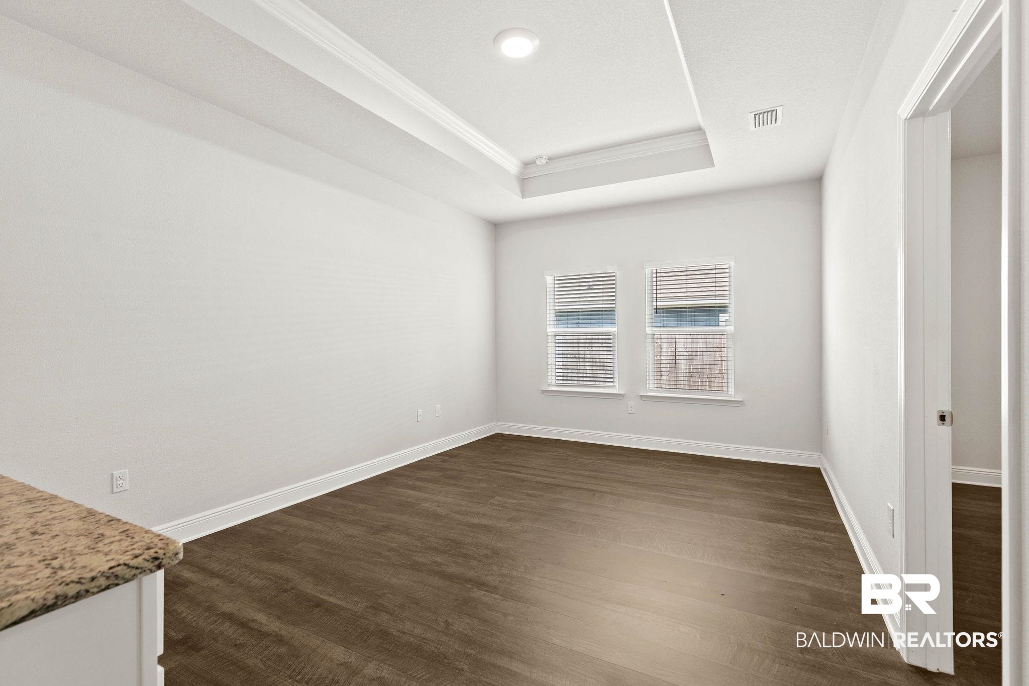 9448 Amethyst Drive Daphne, AL 36526 - Photo 39 of 61 Spare room featuring crown molding and dark wood-style floors