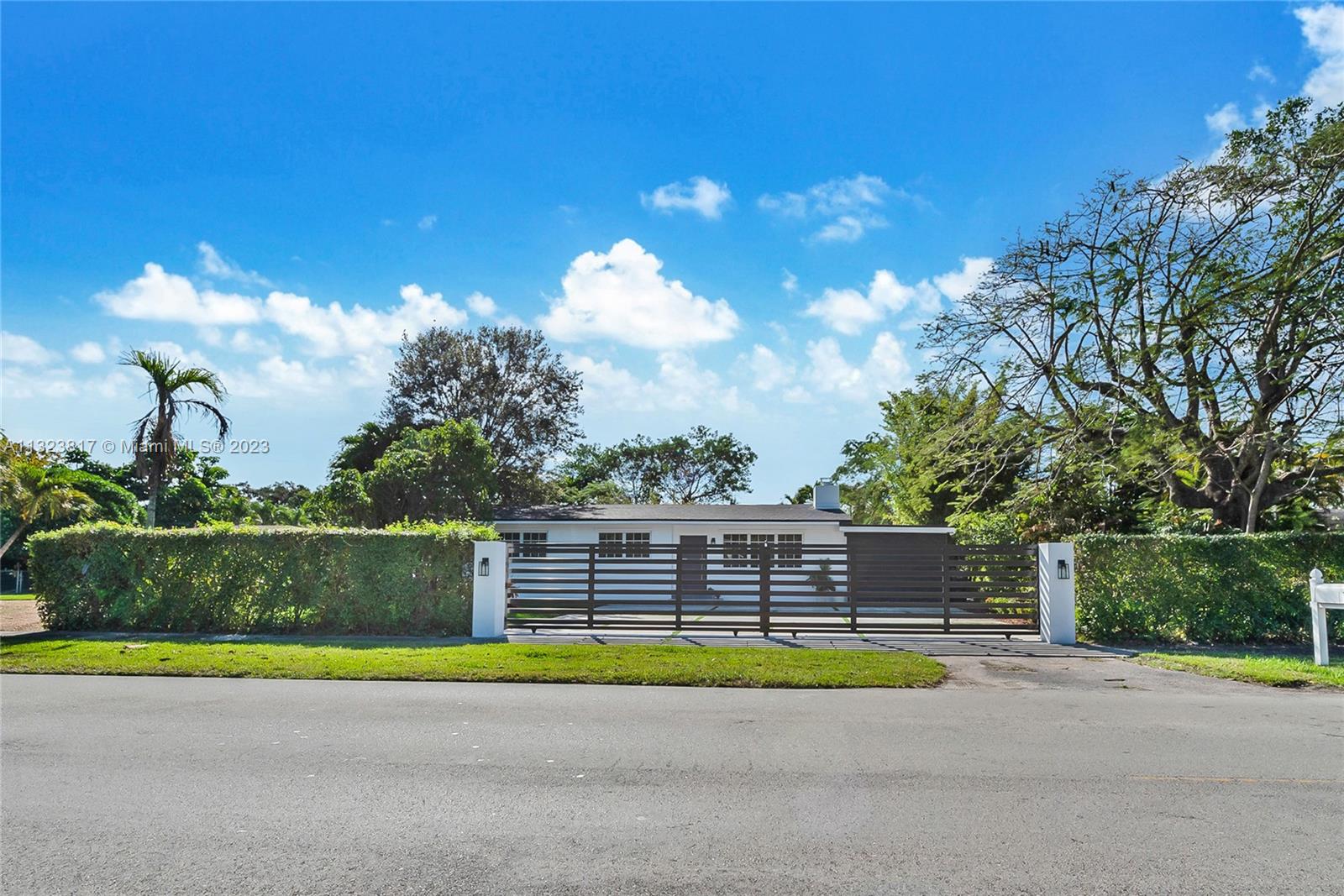 8540 Southwest 124th Street Miami, FL 33156 - Photo 13 of 22 a view of swimming pool with a yard and seating area
