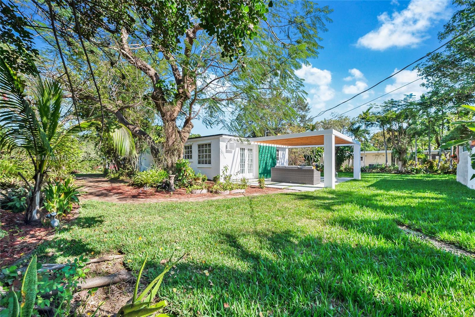 8540 Southwest 124th Street Miami, FL 33156 - Photo 15 of 22 a front view of house with yard and green space