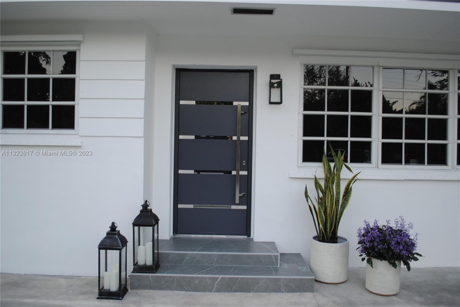 8540 Southwest 124th Street Miami, FL 33156 - Photo 19 of 22 a view of front door with potted plant
