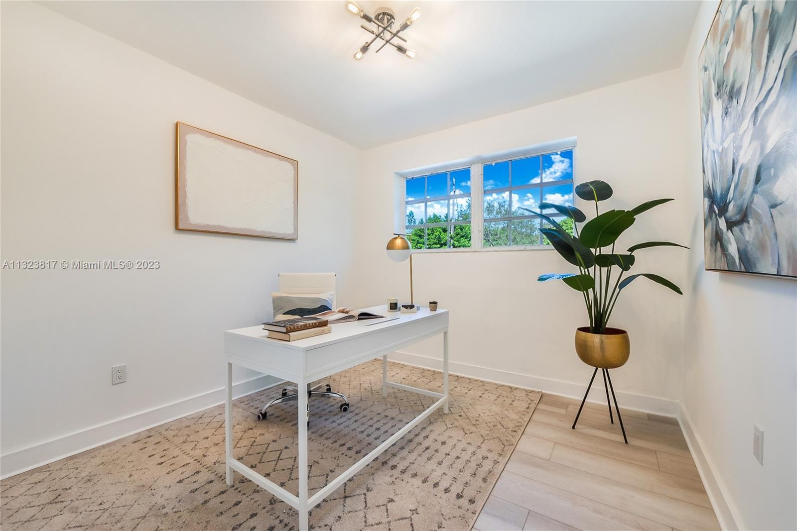 8540 Southwest 124th Street Miami, FL 33156 - Photo 8 of 22 a view of a workspace with furniture