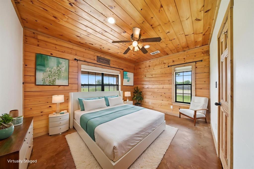 465 Emberson Ranch Road Pilot Point, TX 76258 - Photo 19 of 40 a bed room with a bed and a window