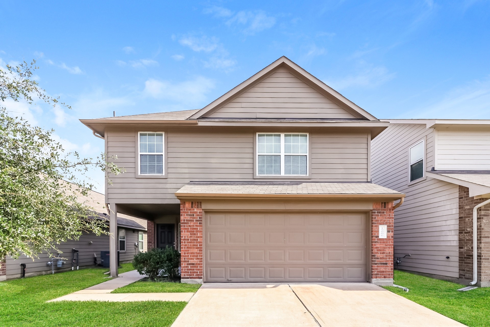19006 Treviso Terrace Lane Katy, TX 77449 - Photo 1 of 17 a front view of a house with a yard and garage
